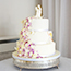 Cascading purple flowers and little girl wedding cake