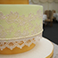 Airbrushed pale lime green and wrapped in pearlescent cake lace